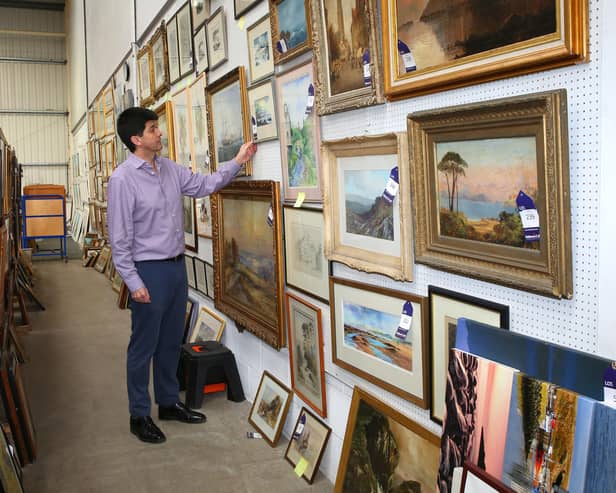 Some of the 200 paintings that covered the walls of the farmhouse.