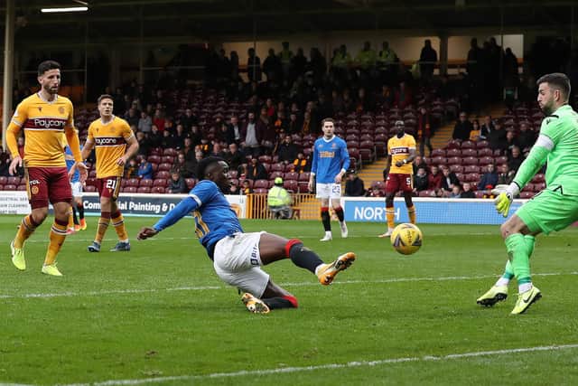 Motherwell goalkeeper Liam Kelly is beaten by Fashion Sakala as the Rangers striker completes his hat-trick in Sunday's Premiership match at Fir Park. (Photo by Ian MacNicol/Getty Images)