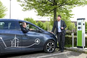 Andrew Mouat (standing), head of smart mobility at Glasgow-based ScottishPower, with Dr Stephen Breslin, CEO at Glasgow Science Centre. Picture: Ian Georgeson