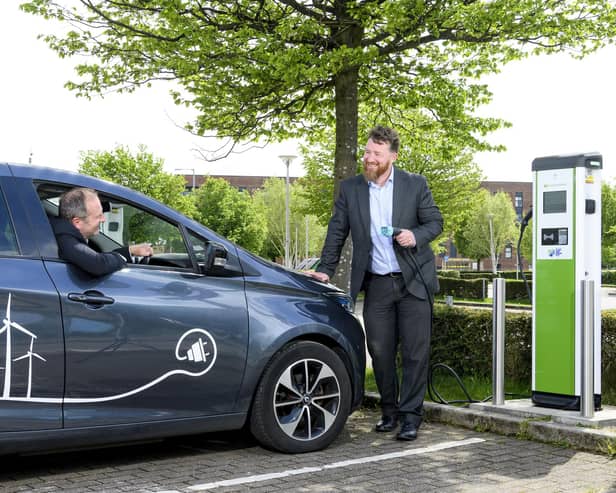 Andrew Mouat (standing), head of smart mobility at Glasgow-based ScottishPower, with Dr Stephen Breslin, CEO at Glasgow Science Centre. Picture: Ian Georgeson