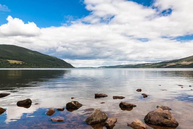 Emergency services have been called to Loch Ness to rescue two men who fell in the water.