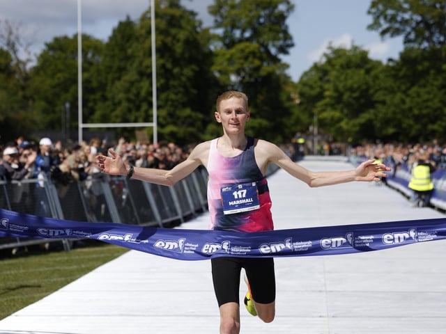 The winner of the male race crosses the finishing line