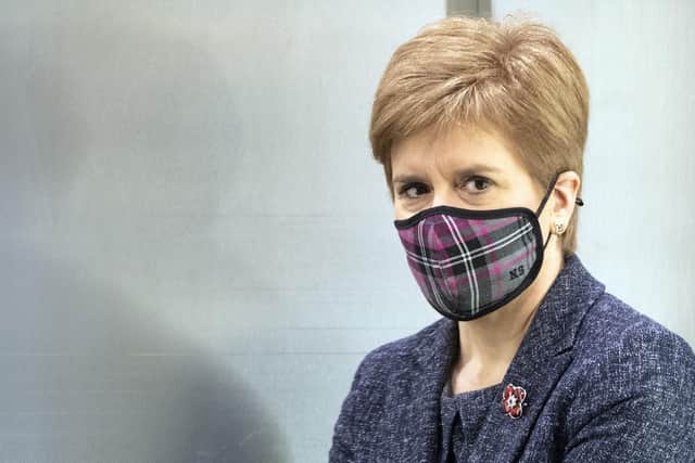 First Minister Nicola Sturgeon arrives wearing a mask because of the coronavirus pandemic to attend First Minister's Questions last week