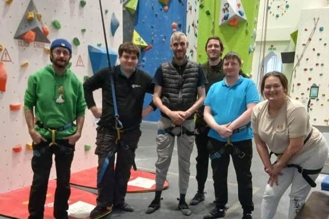 Participants of the New Heights programme at a climbing centre in Kilmarnock - a former church building.