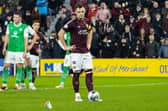 Lawrence Shankland inspects the objects thrown at him during Hearts v Hibs on Wednesday.