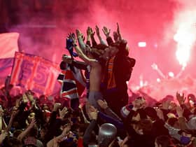Rangers fans gather in George Square to celebrate the club winning the Scottish Premiership for the first time in 10 years (Photo by Jeff J Mitchell/Getty Images)