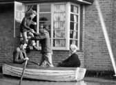 A family in Canvey Island, Essex, is evacuated from their home after the disastrous floods in 1953 (Picture: Topical Press Agency/Getty Images)