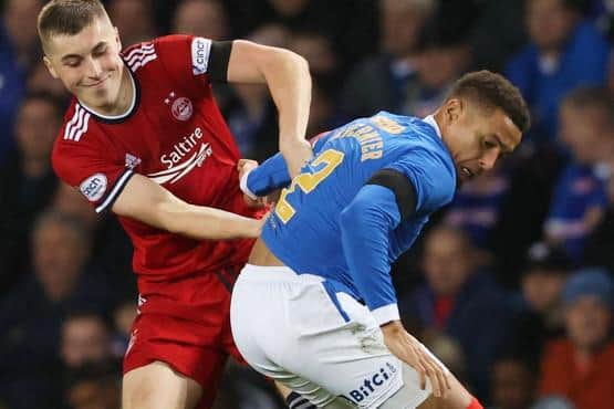 Aberdeen's Dean Campbell (left) tussles with Rangers' James Tavernier during a Cinch Premiership match between Rangers and Aberdeen at Ibrox, on October 26, 2021.  (Photo by Alan Harvey / SNS Group)