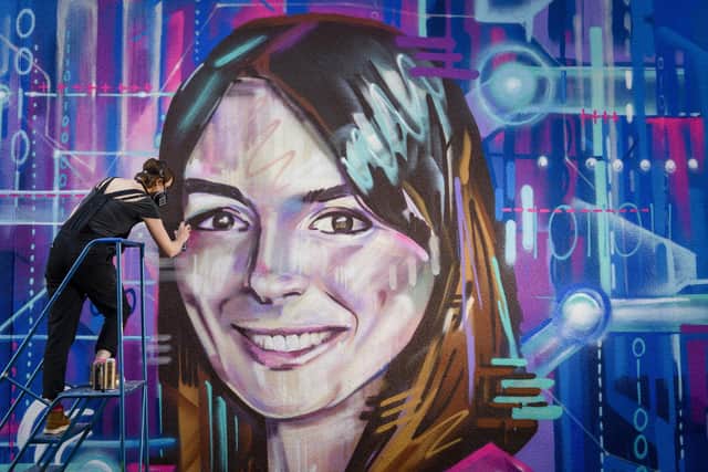 Artist Shona Hardie puts the finish touches to a portrait of digital innovator Natalie Duffield, chief executive of IntechnologySmartCities, at the North Edinburgh Arts centre, which was commissioned for a new street art trail recognising women in science and technology.