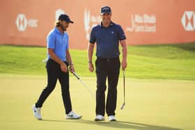 Marc Warren smiles after holing a birdie putt on the 18th green in the final round of the Abu Dhabi HSBC Championship. Picture: Andrew Redington/Getty Images.