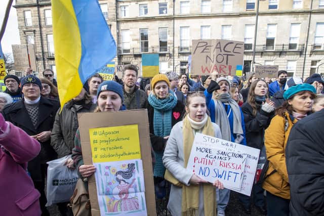 People take part in a demonstration outside the Russian Consulate General in Edinburgh, following the Russian invasion of Ukraine.