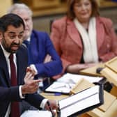 Scottish First Minister Humza Yousaf reacts as he answers questions during First Minister's Questions. Picture: Jeff J Mitchell/Getty Images
