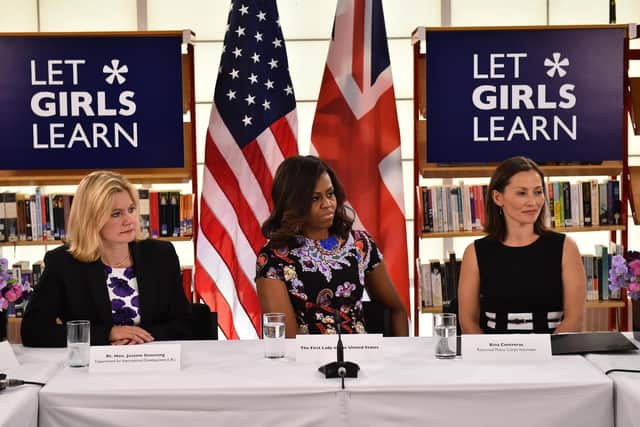 In 2015, when the UK passed a bill committing to spend 0.7 per cent of gross national income on international aid, Michelle Obama and International Development Secretary Justine Greening, left, seen with Peace Corps volunteer Bina Contreras, right, met as part of the then US First Lady's global tour promoting her 'Let Girls Learn Initiative' (Picture: Jeff J Mitchell/Getty Images)