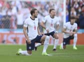 England's Harry Kane takes a knee in support of Black Lives Matter movement prior the Euro 2020 soccer semifinal match between England and Denmark