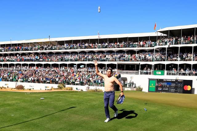 Joel Dahmen tosses a beer in the air with his shirt off on the 16th hole during the final round of the WM Phoenix Open at TPC Scottsdale. Picture: Mike Mulholland/Getty Images.