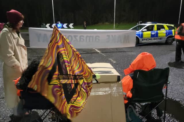 Police patrol at Extinction Rebellion demo at Amazon fulfilment centre in Dunfermline