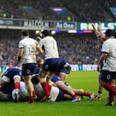 Scotland centre Sione Tuipulotu, with arm raised, celebrates what he thinks is the winning try but Sam Skinner's effort against France was ruled out. Picture: Jane Barlow/PA Wire