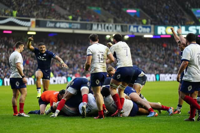 Scotland centre Sione Tuipulotu, with arm raised, celebrates what he thinks is the winning try but Sam Skinner's effort against France was ruled out. Picture: Jane Barlow/PA Wire