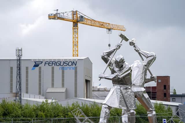 The 'Shipbuilders of Port Glasgow' sculpture alongside the Ferguson Marine shipyard. Picture: Jane Barlow/PA