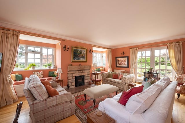 Interior: The hall of the cottage gives access to an open-plan dining-kitchen area with breakfast bar. There is also a utility room, sitting room and study on this level.