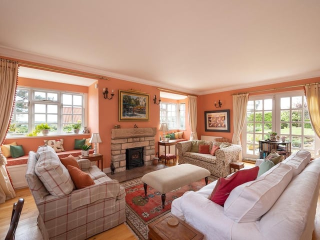 Interior: The hall of the cottage gives access to an open-plan dining-kitchen area with breakfast bar. There is also a utility room, sitting room and study on this level.