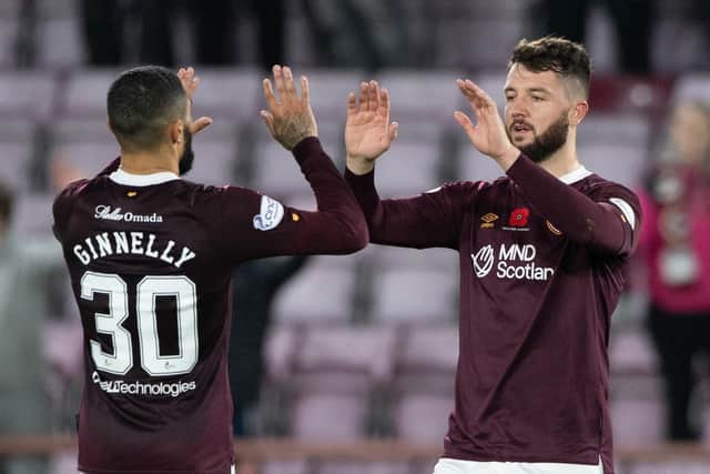 Craig Halkett, right, is back in action with Hearts after injury.