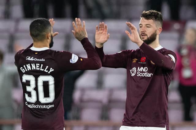 Craig Halkett, right, is back in action with Hearts after injury.
