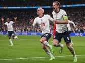 England's forward Harry Kane celebrates with Phil Foden after scoring the winning penalty against Denmark in the semi-final of Euro 2020. (Photo by LAURENCE GRIFFITHS/POOL/AFP via Getty Images)