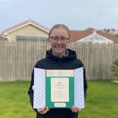 West Kilbride's Louise Duncan shows off her Augusta National Women's Amateur invitation.