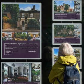 A person looking at advertisements in a estate agents' window. Picture: Yui Mok/PA Wire