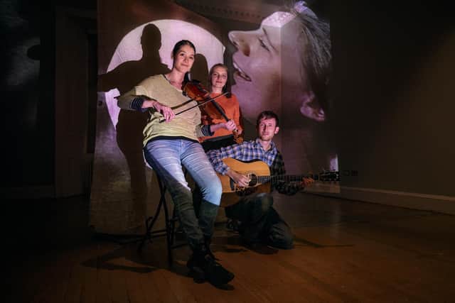 Rachel Walker and Dan Abrahams of Dowally with filmmaker visual artist Yulia Kovanova, against a backdrop singer Dolina McLennan, who features in the new film installation ' Ken Whaur I’m Gaun,' which opens at the French Institute in Edinburgh later this month. Picture: Scott Barron