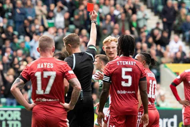 Referee David Dickinson sent off Aberdeen's Liam Scales for his foul on Hibs' Ryan Porteous when the teams met in September.  Photo by Mark Scates / SNS Group