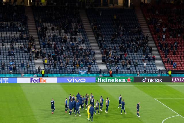 The Scotland players applaud the fans as they bowed out of Euro 2020 courtesy of defeat to Croatia at Hampden. Photo by Ross Parker / SNS Group