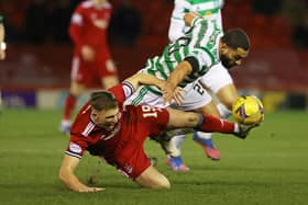 berdeen's Lewis Ferguson  battles with Celtic's Cameron Carter Vickers in the Pittdorie side's 3-2 defeat he believes came with a third visitors's goal that should not have stood and the failure of referee Willie Collum to award him a penalty late on.  (Photo by Craig Williamson / SNS Group)