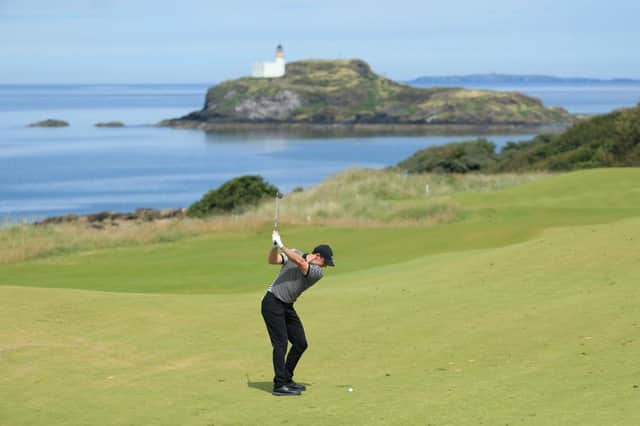 Rory McIlroy play his second shot on the fourth hole during the opening round of the 2019 Aberdeen Standard Investments Scottish Open at The Renaissance Club. Picture: Andrew Redington/Getty Images.