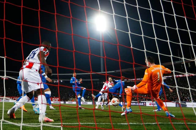 BELGRADE, SERBIA - MARCH 17: Mirko Ivanic of Crvena Zvezda scores their sides first goal past Allan McGregor of Rangers during the UEFA Europa League Round of 16 Leg Two match between Crvena Zvezda and Rangers FC at Rajko Mitic Stadium on March 17, 2022 in Belgrade, Serbia. (Photo by Srdjan Stevanovic/Getty Images)