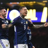 Lyndon Dykes celebrates netting Scotland's second goal in the 3-0 win over Ukraine with the scorer of the opener, John McGinn.  (Photo by Craig Foy / SNS Group)