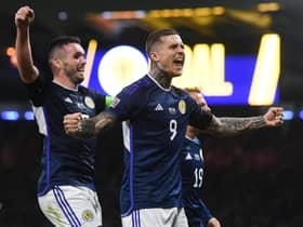 Lyndon Dykes celebrates netting Scotland's second goal in the 3-0 win over Ukraine with the scorer of the opener, John McGinn.  (Photo by Craig Foy / SNS Group)
