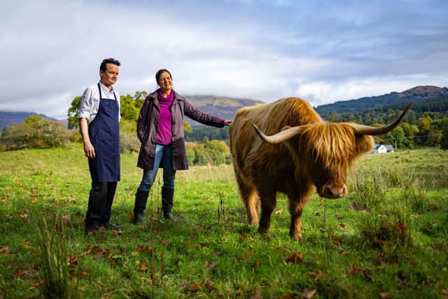 The Pierhouse chef Michael Leathley and farmer Jane Isaacson with a Highland Coo