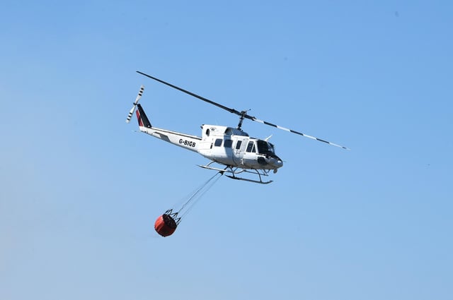 The Scottish Fire and Rescue Service has been using a helicopter to drop water in the Innerleithen blaze