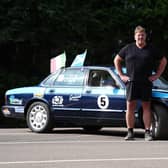 Alan Watt  with the Jaguar car he is driving to Rome
