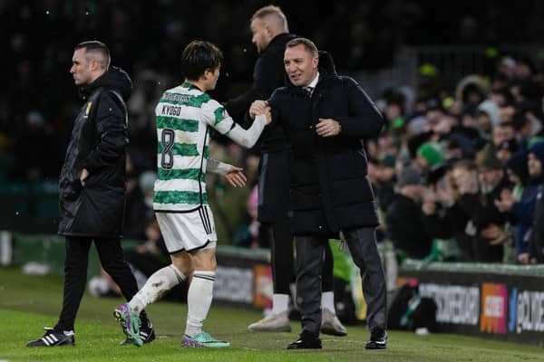 Kyogo Furuhashi is warmly embraced by his Celtic manager Brendan Rodgers after scoring the opener in a 2-0 win over Livingston.