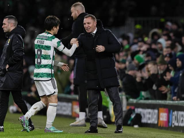 Kyogo Furuhashi is warmly embraced by his Celtic manager Brendan Rodgers after scoring the opener in a 2-0 win over Livingston.