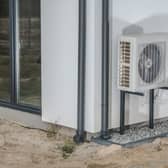 Although Scotland isn't included on the recent UK government scheme, there are other ways to get financial support for installing a heat pump in your home. Photo: welcomia / Canva Pro.