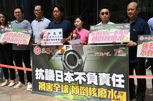 Members of the Hong Kong Federation of Trade Unions hold a protest outside the Japanese consulate in Hong Kong after Tokyo announced it was going ahead with releasing waste water from its Fukushima nuclear power plant. They are holding a banner which translates to "Protesting Japan's Irresponsibility in Endangering the Globe by releasing radioactive water".