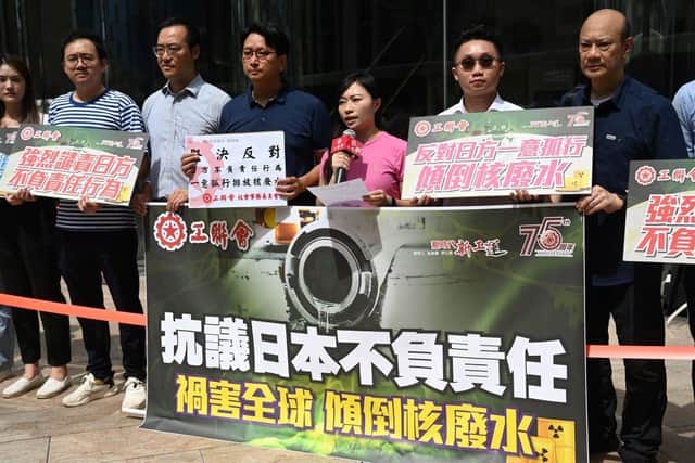 Members of the Hong Kong Federation of Trade Unions hold a protest outside the Japanese consulate in Hong Kong after Tokyo announced it was going ahead with releasing waste water from its Fukushima nuclear power plant. They are holding a banner which translates to "Protesting Japan's Irresponsibility in Endangering the Globe by releasing radioactive water".