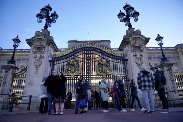 People outside Buckingham Palace in London, after the Princess of Wales revealed she is undergoing chemotherapy treatment for cancer. Photo: Yui Mok/PA Wire
