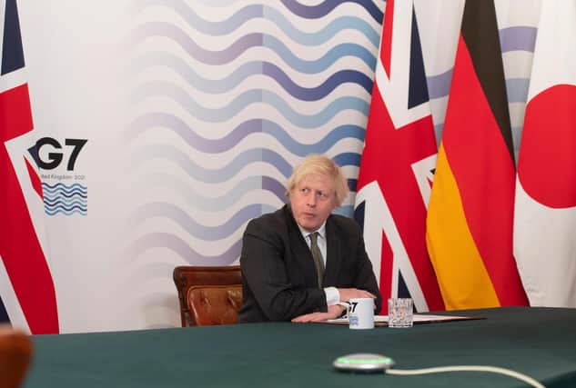 The cost of a new No10 conference room for Boris Johnson - seen in the Cabinet Room - has raised eyebrows (Picture: Getty)