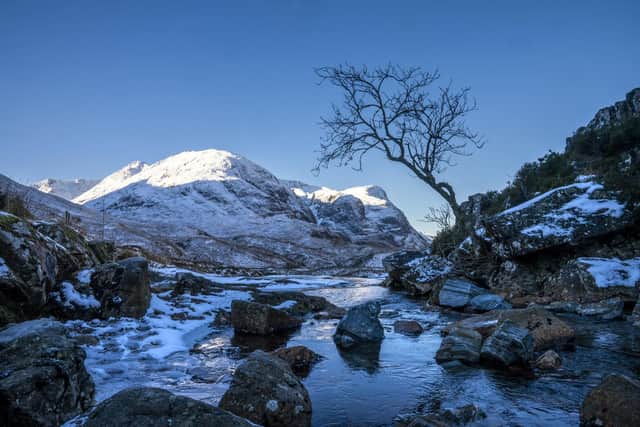 The snow covered peaks of the Three Sisters in Glencoe. Picture: Jane Barlow/PA Wire