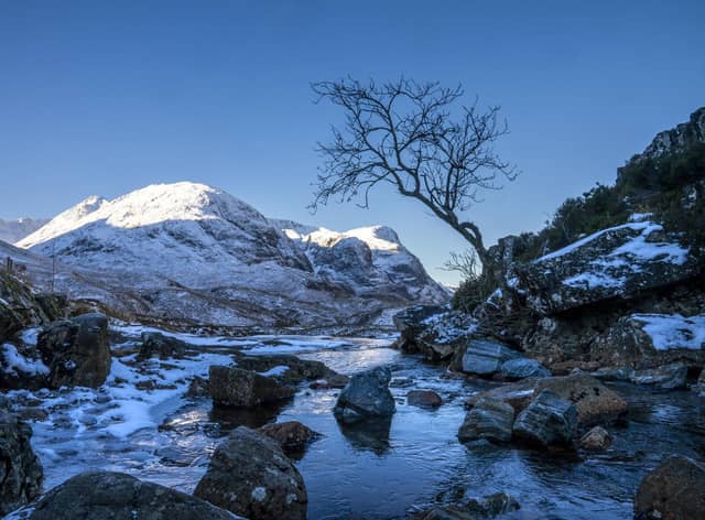 The snow covered peaks of the Three Sisters in Glencoe. Picture: Jane Barlow/PA Wire